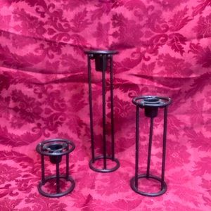 A set of Three candle stick holders